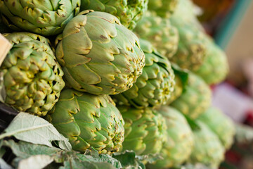 Fototapeta premium Fresh artichokes on market counter