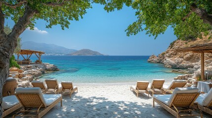 Obraz premium a view of the lovely gialos beach in ios greece featuring sun loungers beach couches beach chairs and table