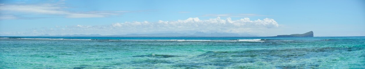 Panoramic view of Coin de Mire (Gunner's Quoin), a protected island 8 km off Mauritius' northern coast, and Mauritius island behind 