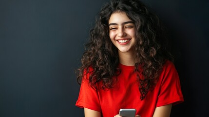 Naklejka premium Happy Woman with Natural Curls Wearing Red Shirt Studio Close-Up Portrait