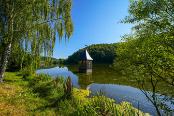 Church in the lake in the Reiherbach near Nieder-Werbe. Church tower top in the Reiherbach...
