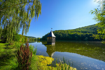 Church in the lake in the Reiherbach near Nieder-Werbe. Church tower top in the Reiherbach...