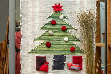 Handmade festive wall hanging with christmas tree and gifts