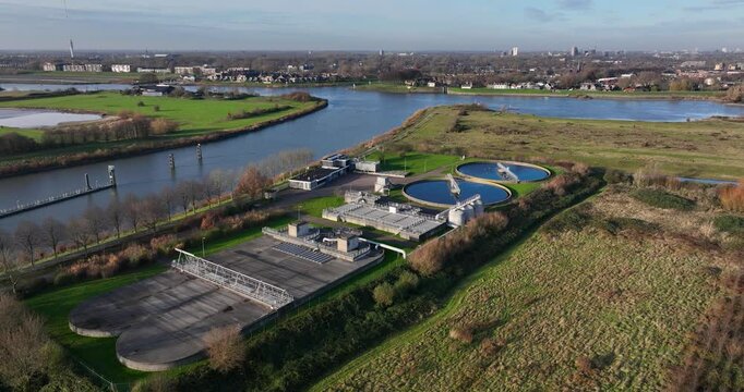 Water treatment plant, purifying cleaning waste water along the lek river in The Netherlands. Aerial drone video