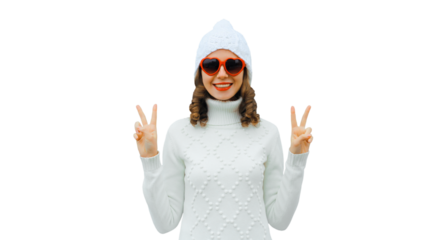Winter portrait of happy young woman smiling with red heart glasses in white hat, sweater isolated