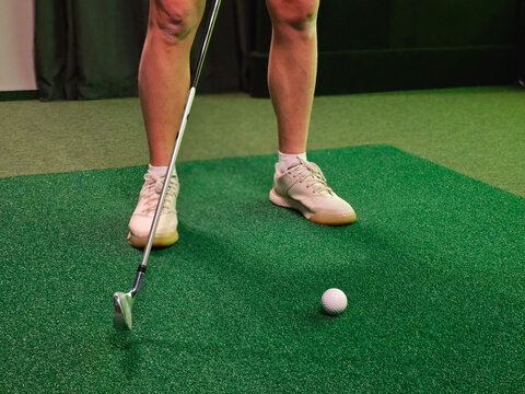 Golfer enjoys playing golf at driving range
