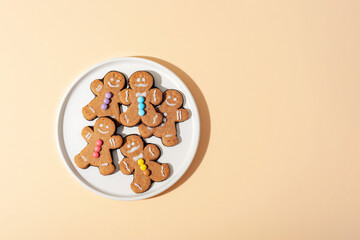 Gingerbread cookies on a white plate. Top view with copy space
