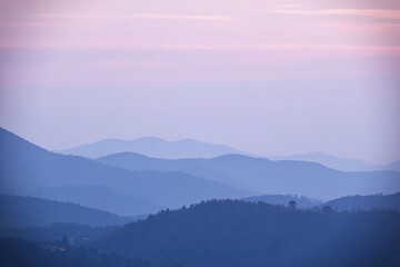 Fototapeta premium Mountain range under gradient sky at dawn or dusk