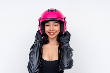 Young motorcycle rider adjusting helmet in stylish black leather gear