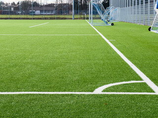 Empty part Soccer pitch from a corners view with a goal