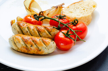 Traditional fragrant fried sausages with herbs on the grill for lunch and dinner.