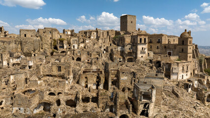 Fototapeta premium Skyline of Craco, a ghost town in the province of Matera, Basilicata, Italy. The historic center was depopulated due to a landslide and has become a tourist destination.