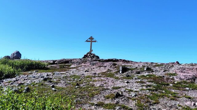 Religion Symbol. Wooden cross on top mountain. Christianity religion prayer. Crucifix symbol on hill. 