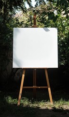 Giant blank canvas on a small easel in a garden setting during daylight