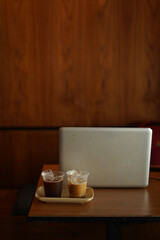 two cups of ice coffee on the wood table