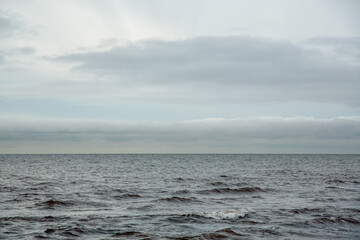 Peaceful and minimalistic seaside view at the Baltic sea in Skulte in Latvia in November
