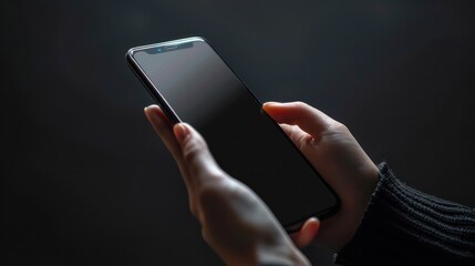 Image of a hand using a mobile phone