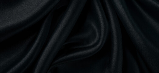 Obraz premium Black fabric background with a cross-sectional texture.