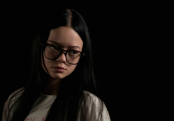 Portrait image of a young girl in the dark