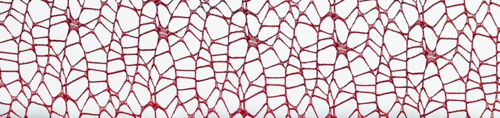 A fragment of lace fabric against the background of nature