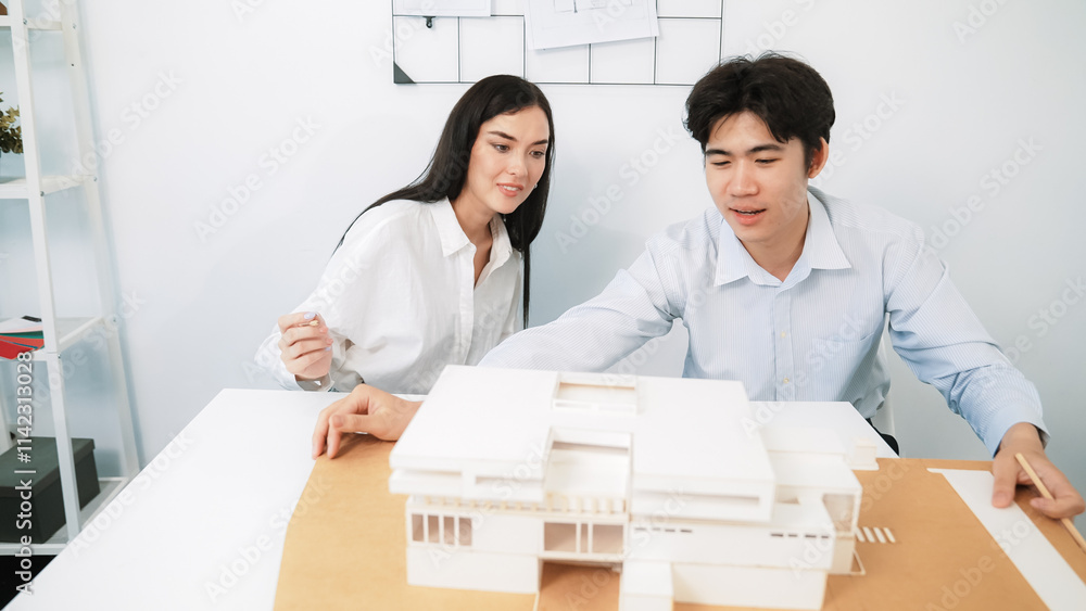 Aufkleber closeup of skilled architecture engineer team measure and decide house model while working together 