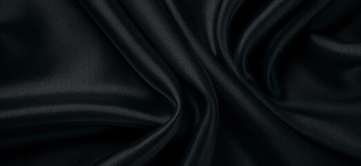 Black fabric background with a cross-sectional texture.