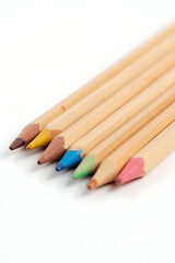 A set of wooden pencils is neatly arranged on a plain white surface to showcase various colorful options._00001_