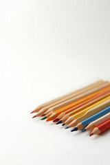 A set of wooden pencils is neatly arranged on a plain white surface to showcase various colorful options._00003_