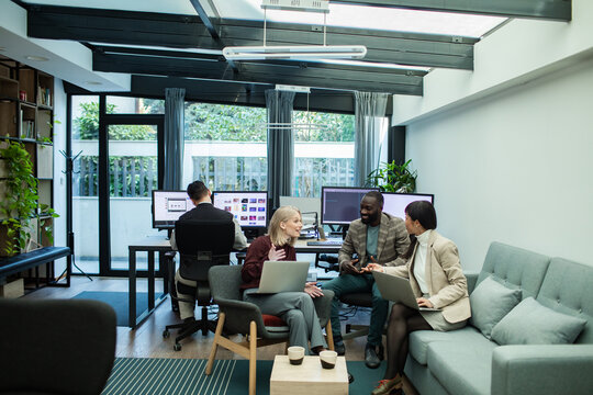Team brainstorming meeting in modern conference room