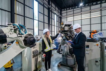 Engineers Collaborating in a Modern Industrial Facility During a Robotic Demonstration