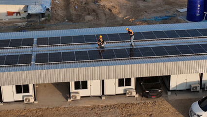 Workers Install Solar Panels on a Roof in a Construction Site During Daylight Hours