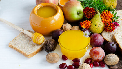 Fragrant table with fresh honey and sweet fruits, apples of autumn. Good harvest.