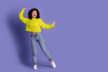 Full body photo of attractive young woman dancing have fun dressed stylish yellow clothes isolated...