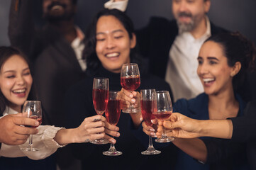 Christmas Day Businessman and business partners are successful, fun and happy at a group celebration party.