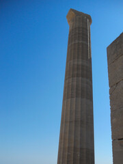 Ancient column under a clear blue sky