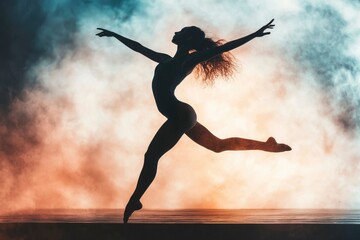 Naklejka premium Graceful Dancer Leaps Through Smoky Stage Haze