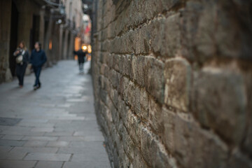 Old stones of wall in The Gothic Quarter, Barcelona, Spain.