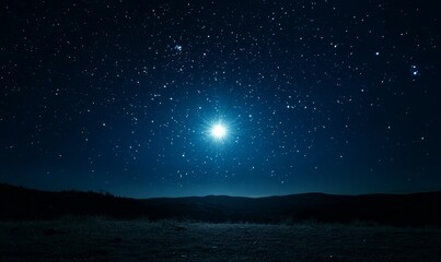Night sky, bright star, distant hills, dark landscape.