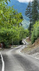 Kupwara, Kashmir destination a beautiful place having hills, green trees and parks, through roads under blue cloudy sky. Kupwara, Kashmir destination a beautiful place having hills, green trees.