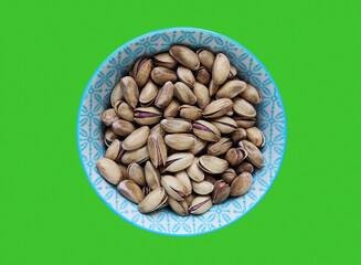 Fresh natural dried pistachios in a decorative plate	