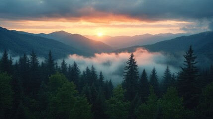 A serene mountain landscape at sunset, with mist rising among the trees.
