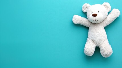 Soft and Cuddly Teddy Bear on Teal Pastel Background with Copy Space