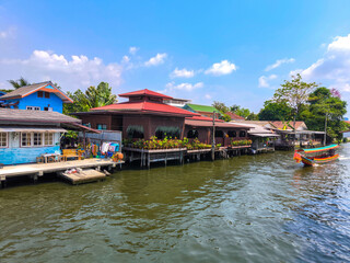 The beautiful view of long tail boat and houes riverside at Khlong bang luang river, bangkok.