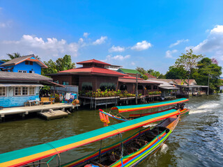 The beautiful view of two long tail boat,.In the opposite direction and house riverside at Khlong...