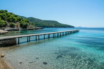 Obraz premium Serene Wooden Pier Overlooking Clear Blue Waters