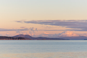 Scenic Coastal Landscape at Sunrise with Mountains and Clouds in Vancouver Island