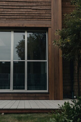 Fototapeta premium Modern Home Exterior with Multi-Pane Window and Deck