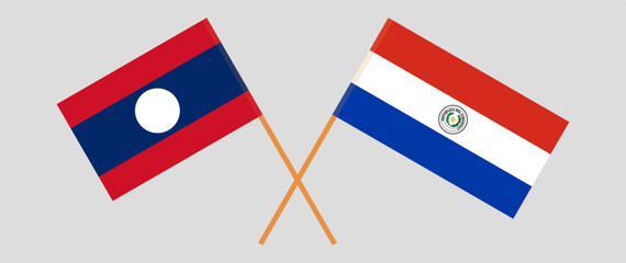 Crossed flags of Laos and Republic of Paraguay. Official colors. Correct proportion. Vector illustration