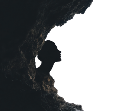 Silhouette of a face in a cave, symbolizing introspection and self-discovery.