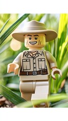 Smiling explorer minifigure in jungle foliage.